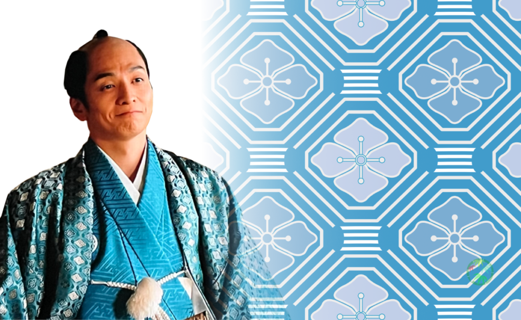 八角形と四角形を組み合わせた蜀江文様（しょっこうもんよう）を背景に、大河ドラマで一橋治済を演じる俳優の姿